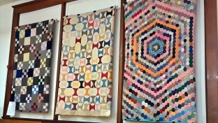 Take a moment to check out the handmade quilts hanging in the Homestead Room and the Schoolroom.