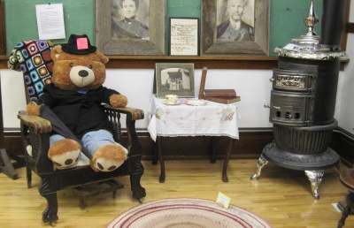 Mountain View Arts Festival's mascot, Art the Bear, enjoying a relaxing sit in our Homestead Room.